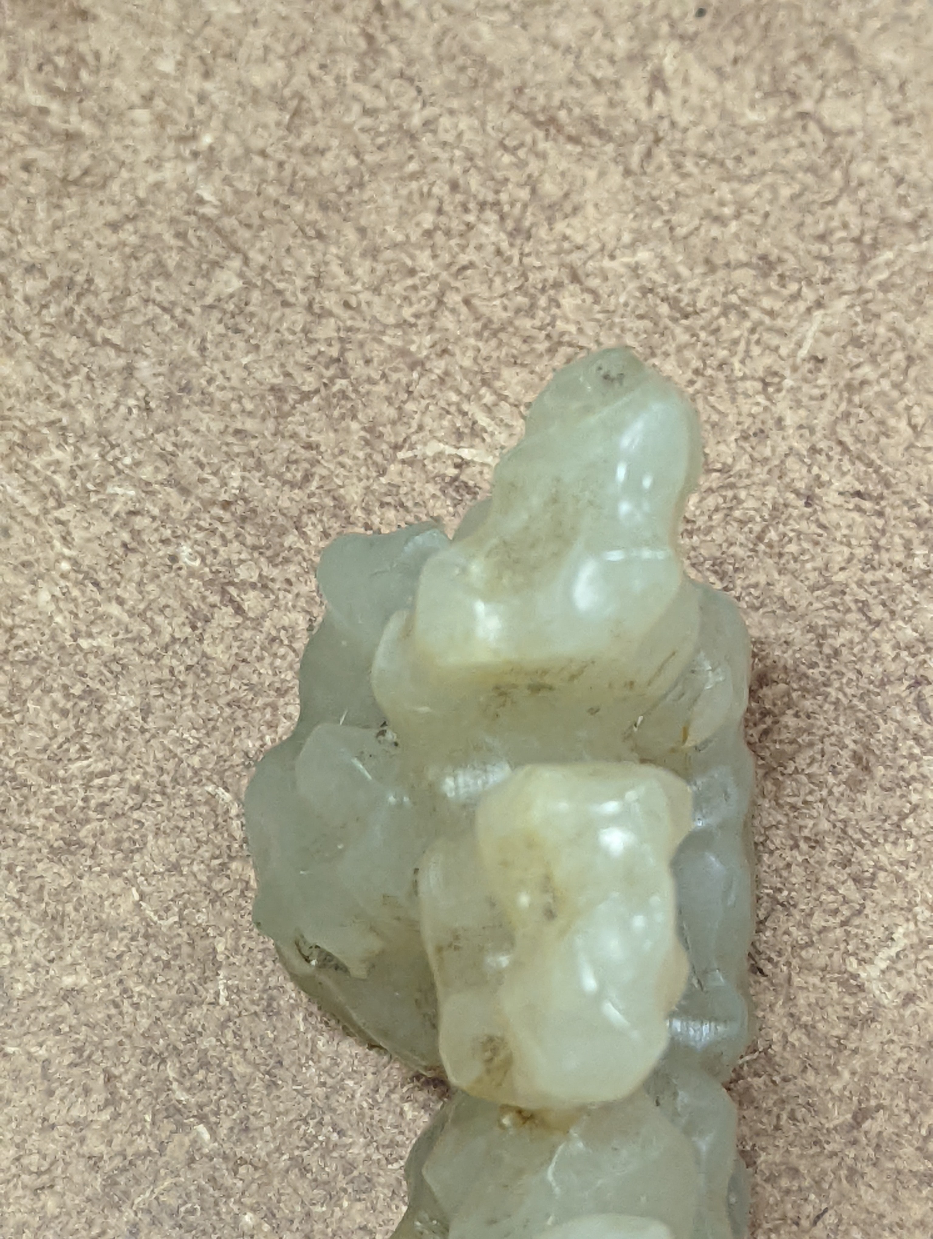 A Chinese celadon jade brush rest, 8cms wide